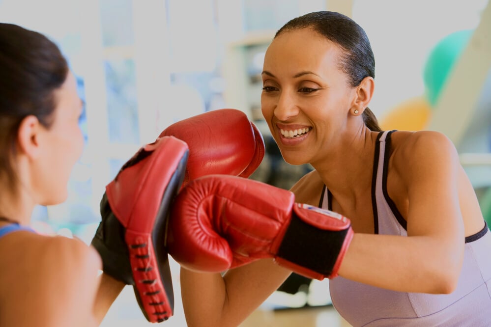 Women Boxing Together at Gym